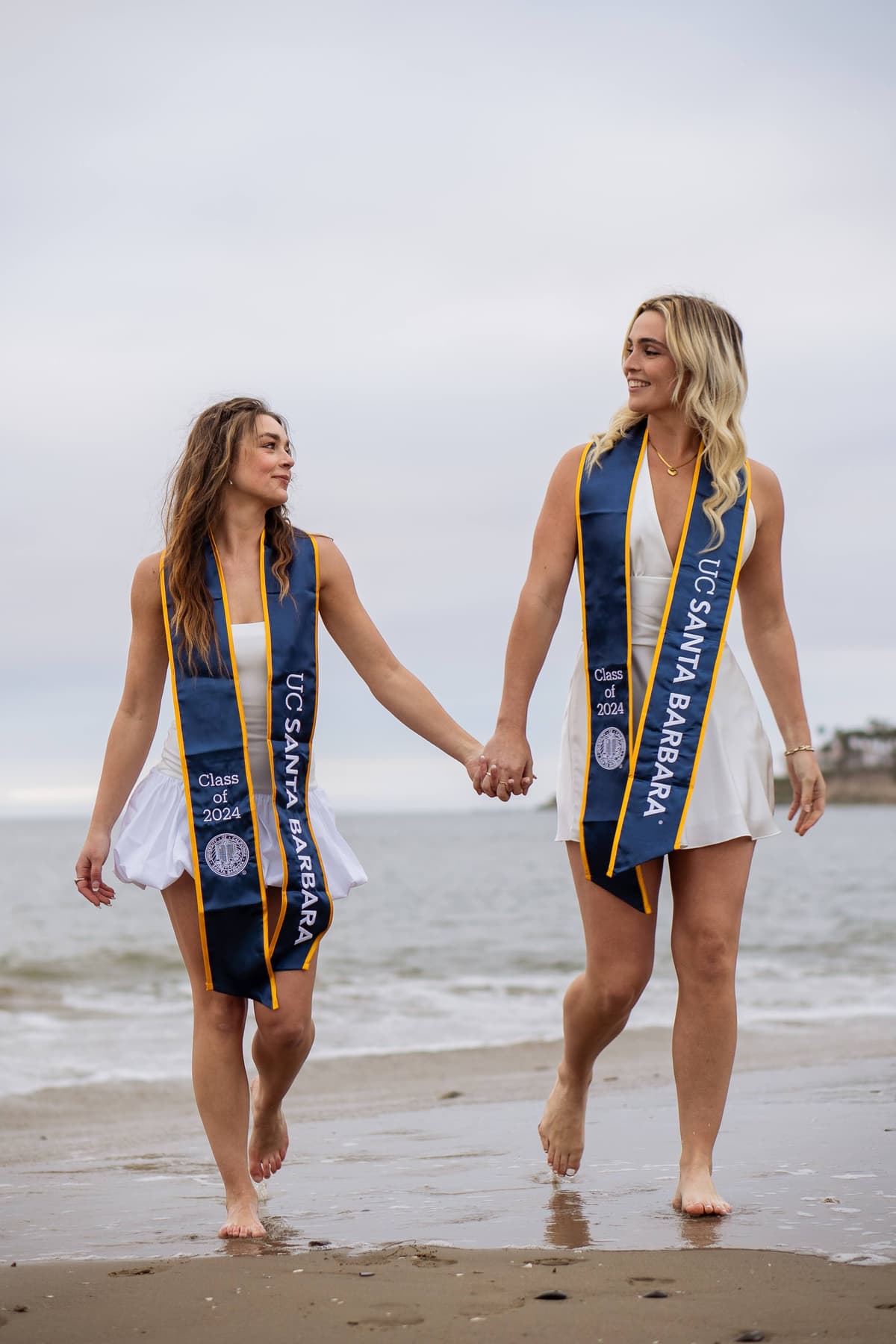 Graduate walking on campus